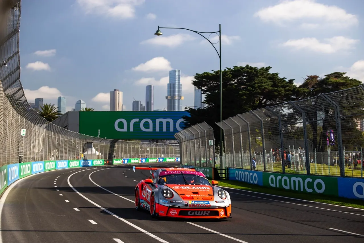 Dexion Porsche 911 GT3 Cup car racing at Albert Park past Aramco signage