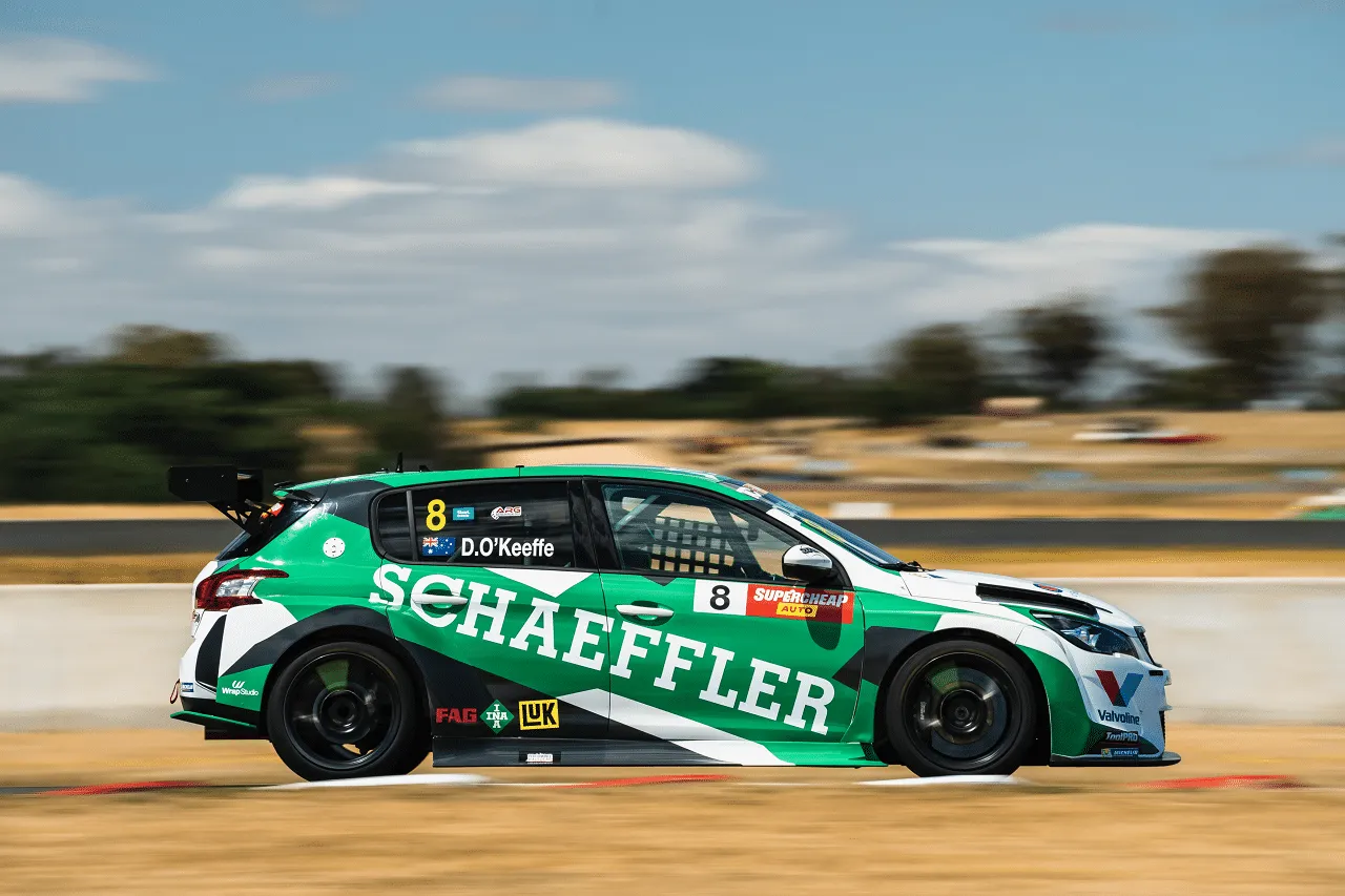 The #8 Schaeffler Peugeot 308 TCR car in side profile, panned for motion blur