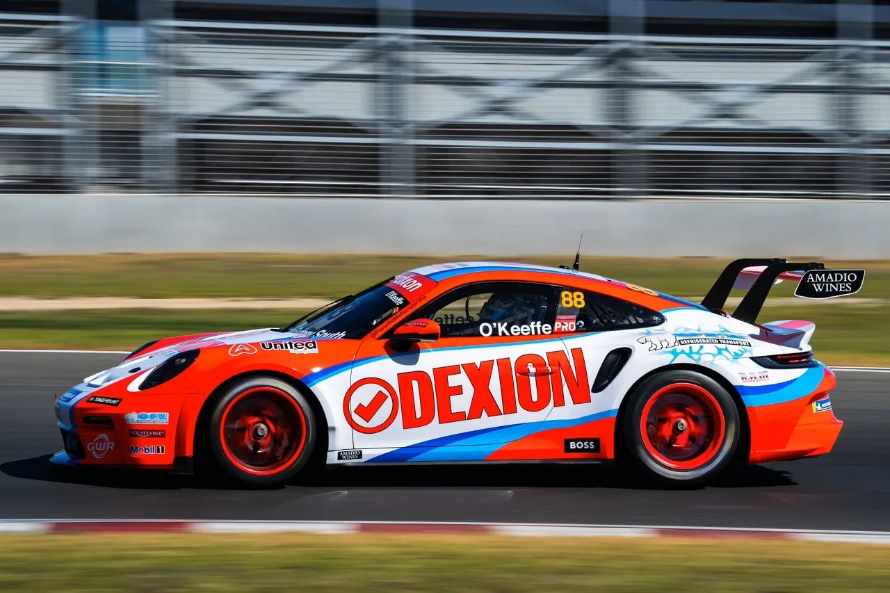 Side view of the number 88 Dexion Porsche 911 GT3 Cup car at speed
