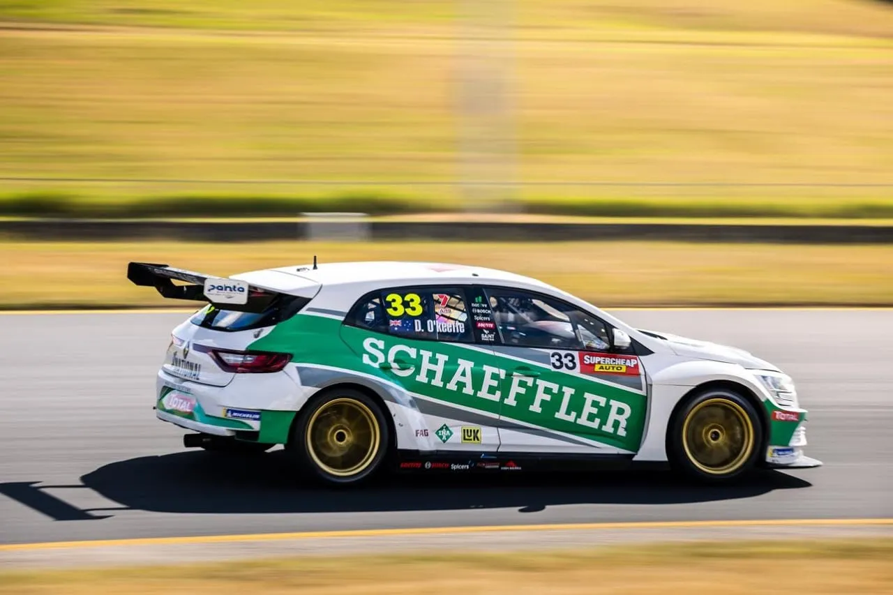 The #33 Schaeffler Renault Megane TCR car in white and green on track, side on, with Supercheap Auto decals