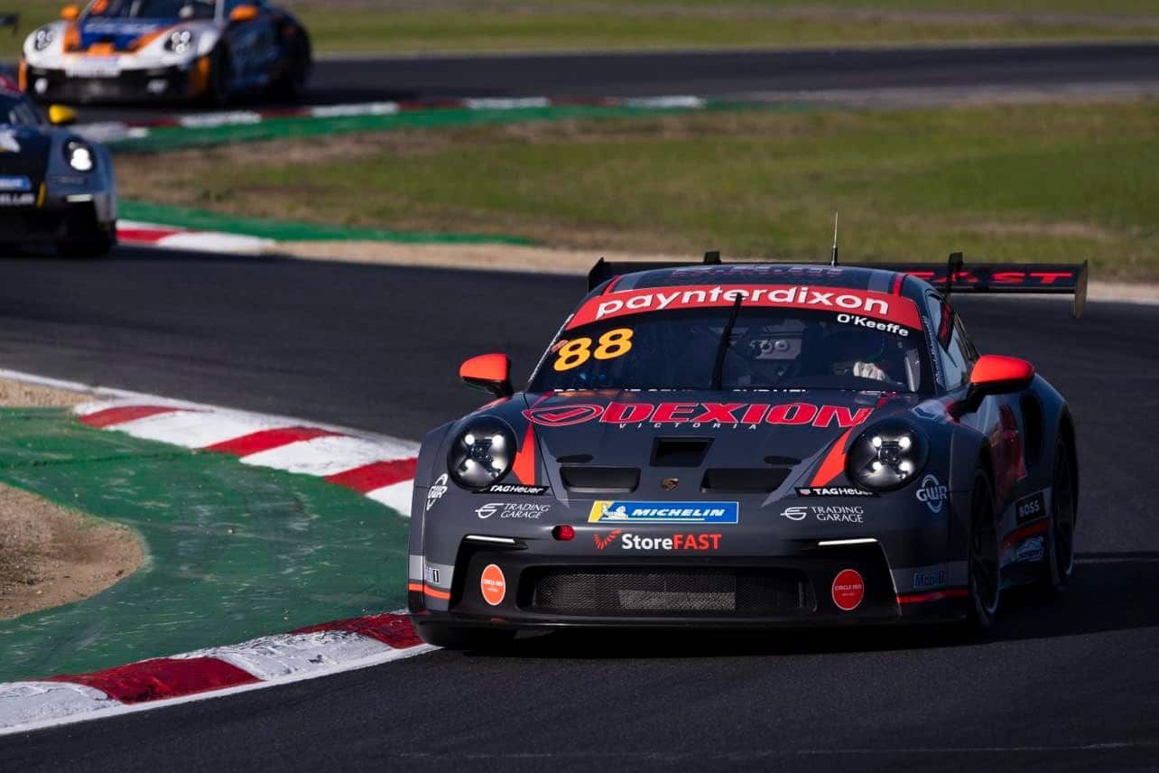 The #88 Dexion Porsche GT3 Cup car on track with other Carrera Cup cars behind