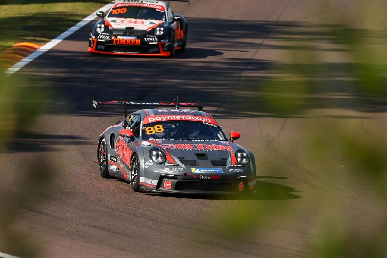 The #88 Dexion Porsche GT3 Cup car on track with another Porsche following behind