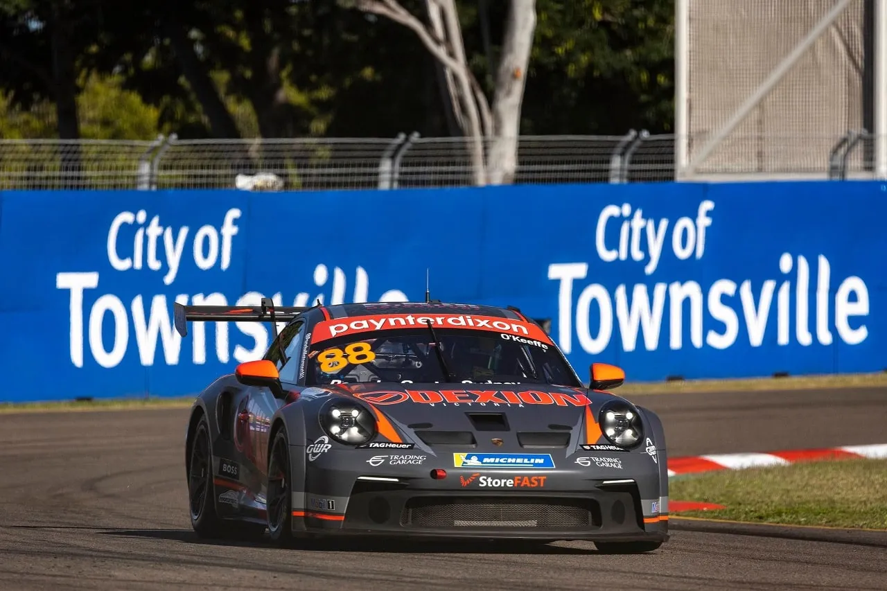 Front view of the #88 Dexion Porsche GT3 Cup car beside a City of Townsville barrier