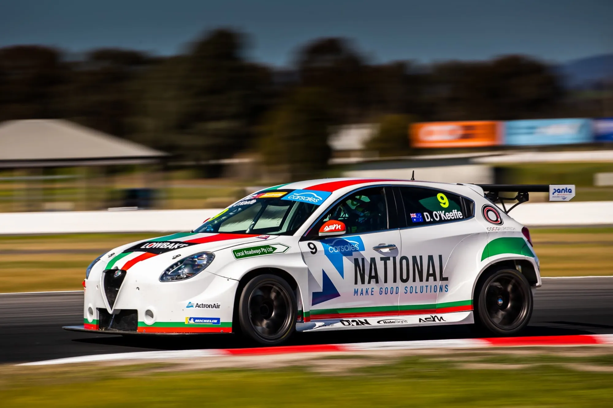 Side view of Dylan O’Keeffe’s #9 National Alfa Romeo Giulietta TCR car on track