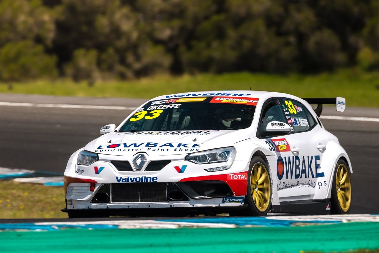 The white #33 Lowbake Renault Megane TCR car on track, viewed from the front three-quarter