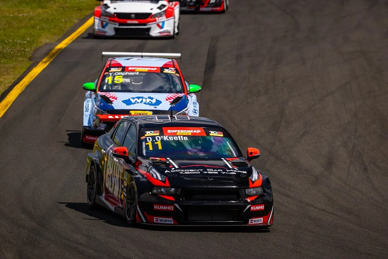 Black number 11 Autoglym Lynk & Co TCR car running ahead of the number 15 TCR car on track