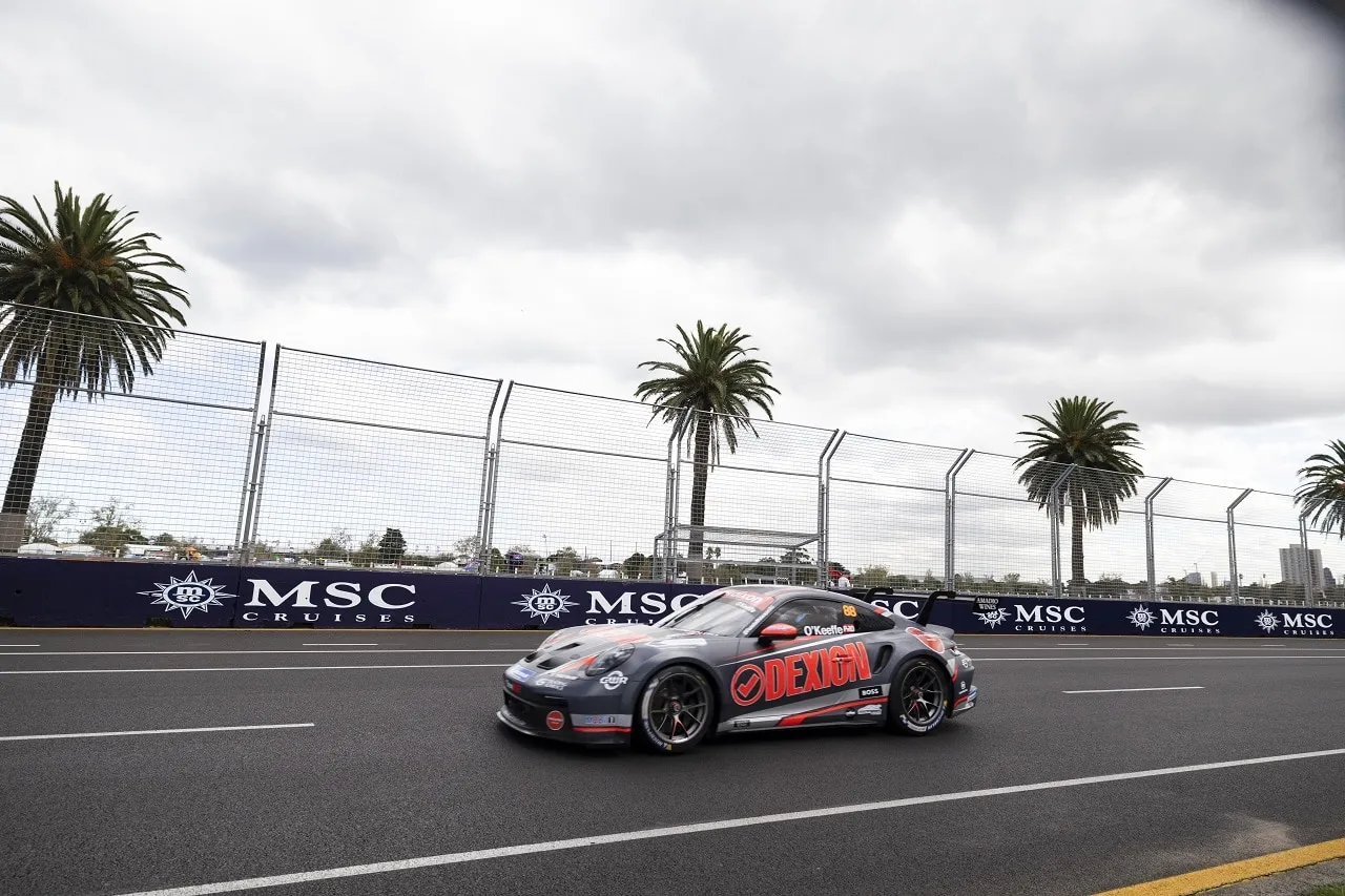 The #88 Dexion Porsche GT3 Cup car on a street circuit lined with palm trees and MSC Cruises barriers