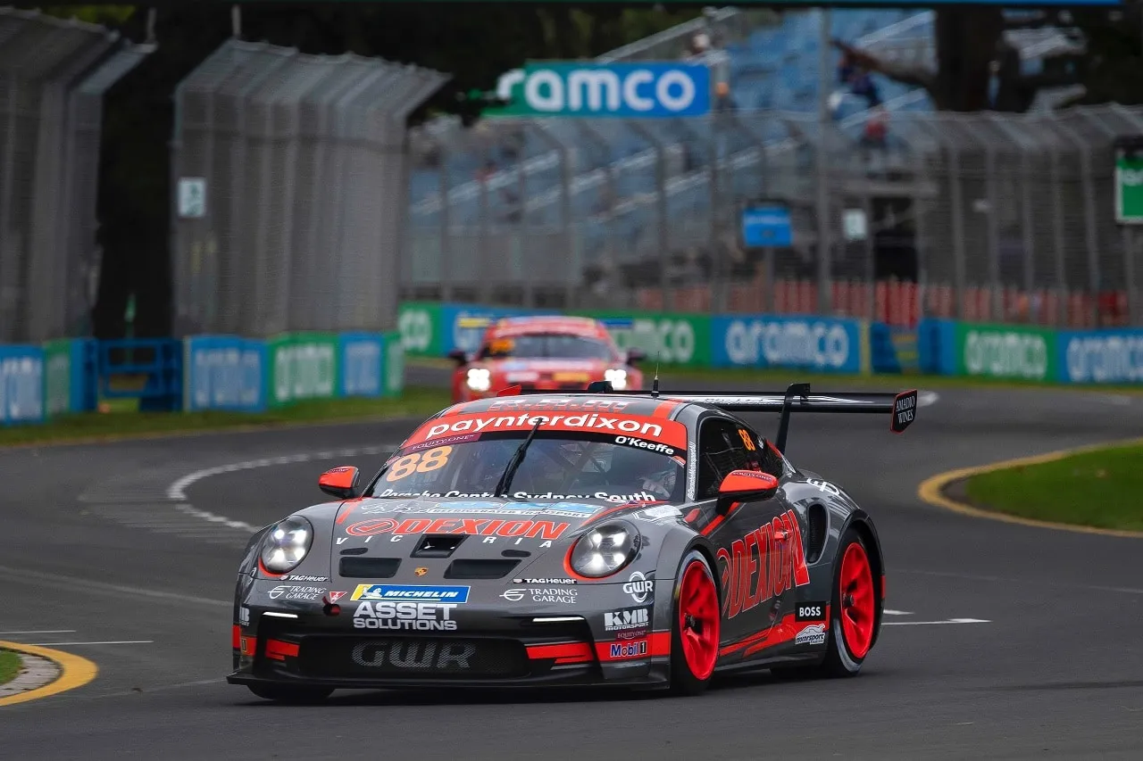 The number 88 Dexion Porsche 911 GT3 Cup car cornering at Albert Park with Aramco signage behind