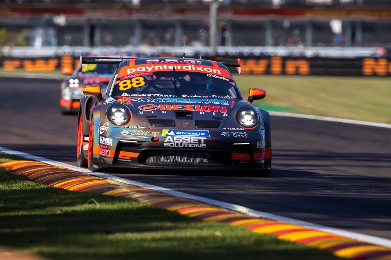 The number 88 Dexion Porsche 911 GT3 Cup car driving along a striped kerb at Hidden Valley