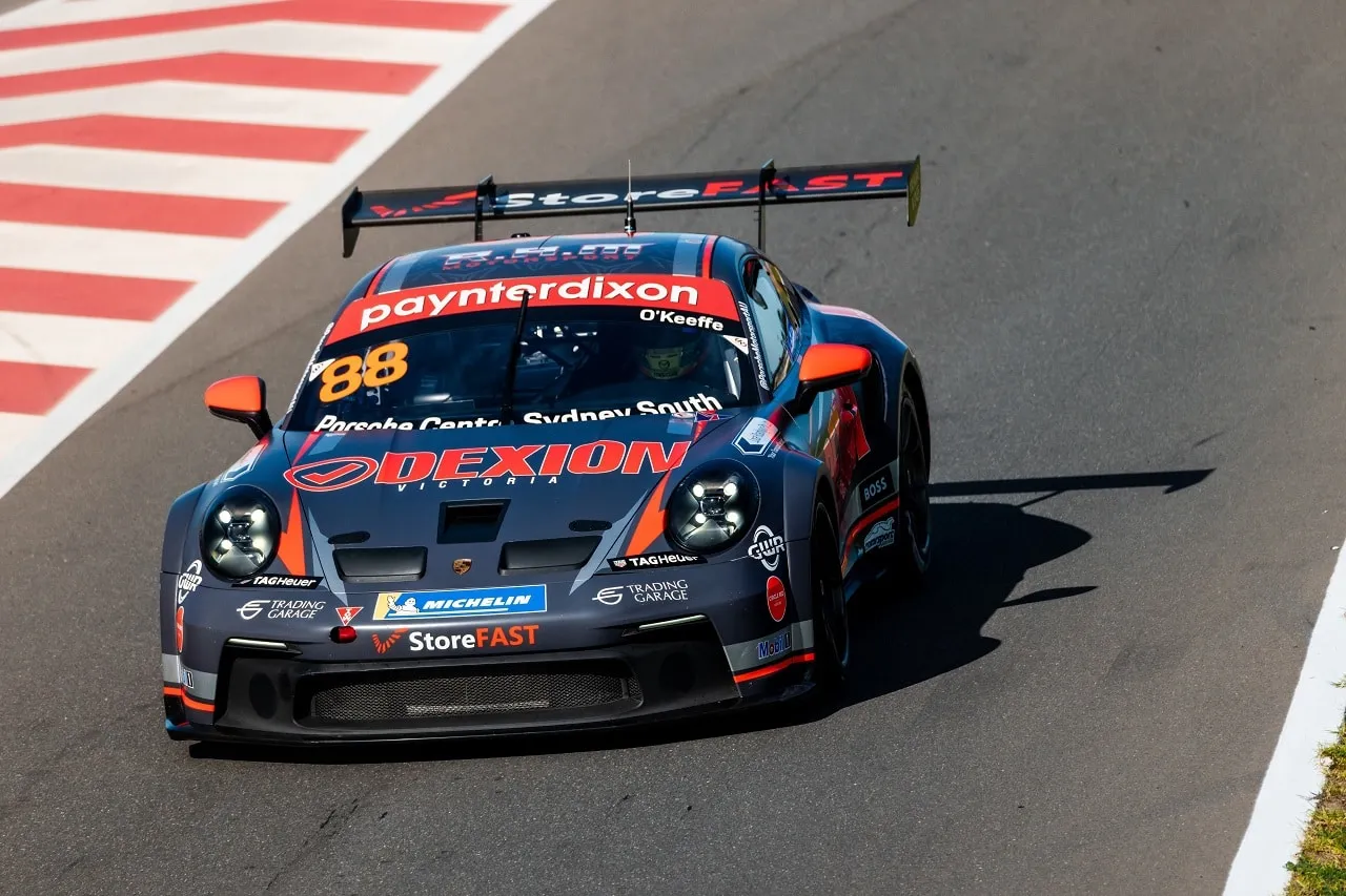 The #88 Dexion Paynter Dixon Porsche GT3 Cup car on track beside red and white kerbing