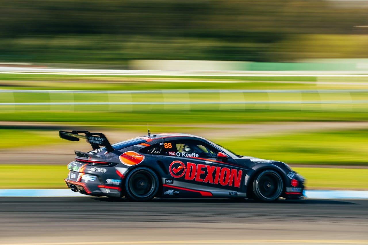 The #88 Dexion Porsche GT3 Cup car in side profile with motion blur