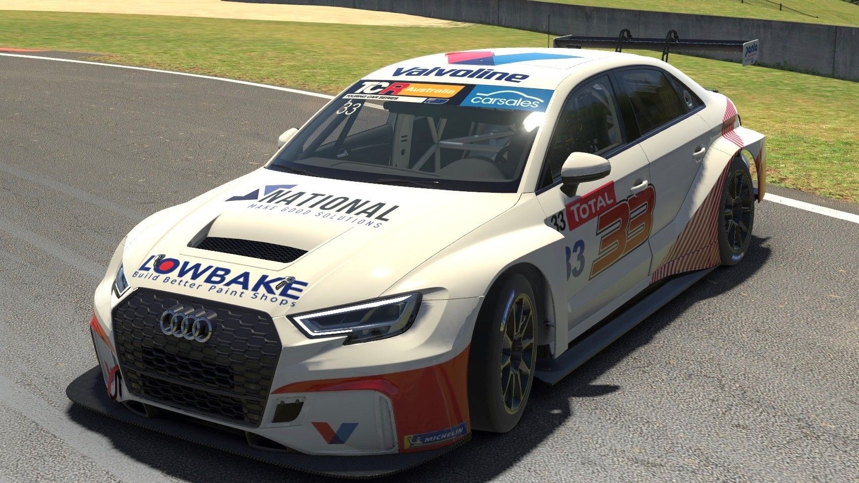 Sim racing screenshot of the white #33 Lowbake Audi RS3 TCR car on track in front three-quarter view