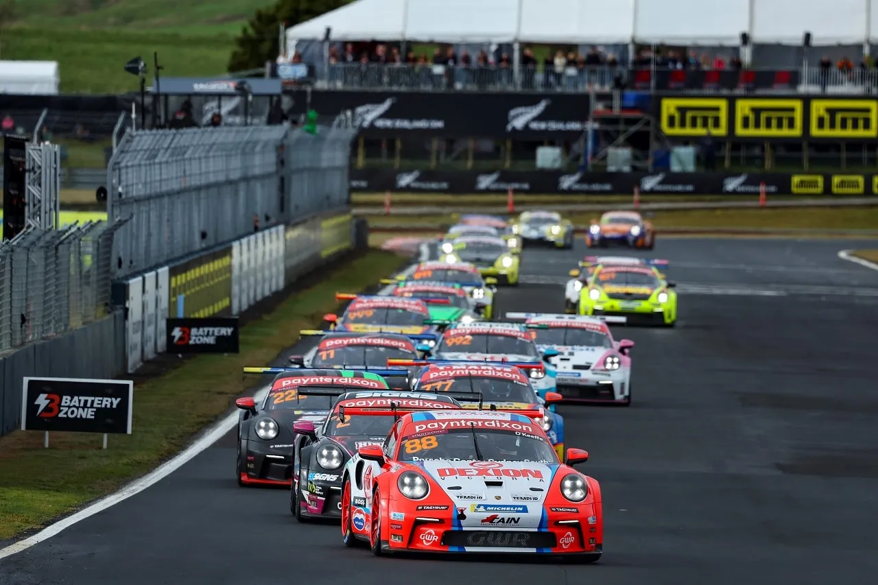 Number 88 Dexion Porsche Carrera Cup car leads the field in a tight pack on the opening lap