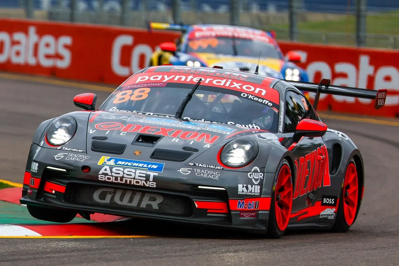 The number 88 Dexion Porsche 911 GT3 Cup car cornering hard on a Townsville street circuit