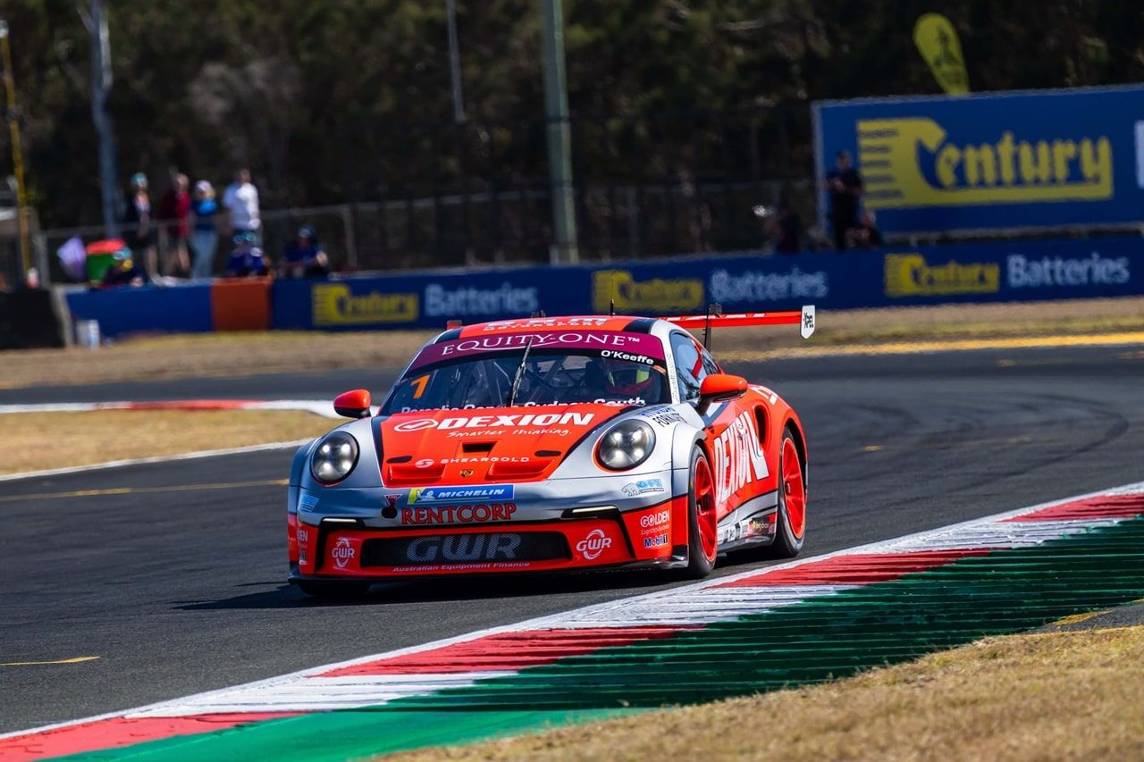 The Dexion Porsche 911 GT3 Cup car rounding a corner at The Bend