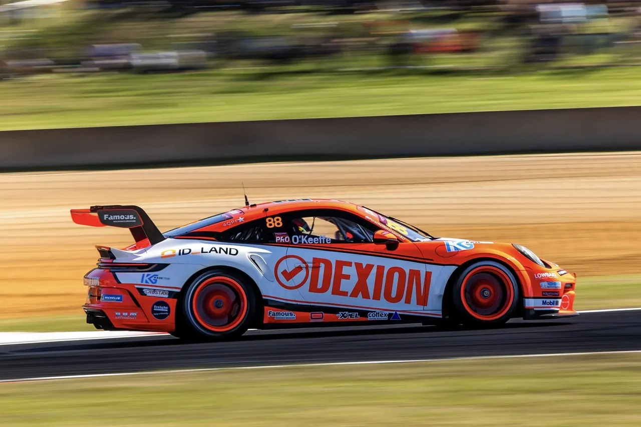 The Dexion Porsche side-on at speed, the background blurred
