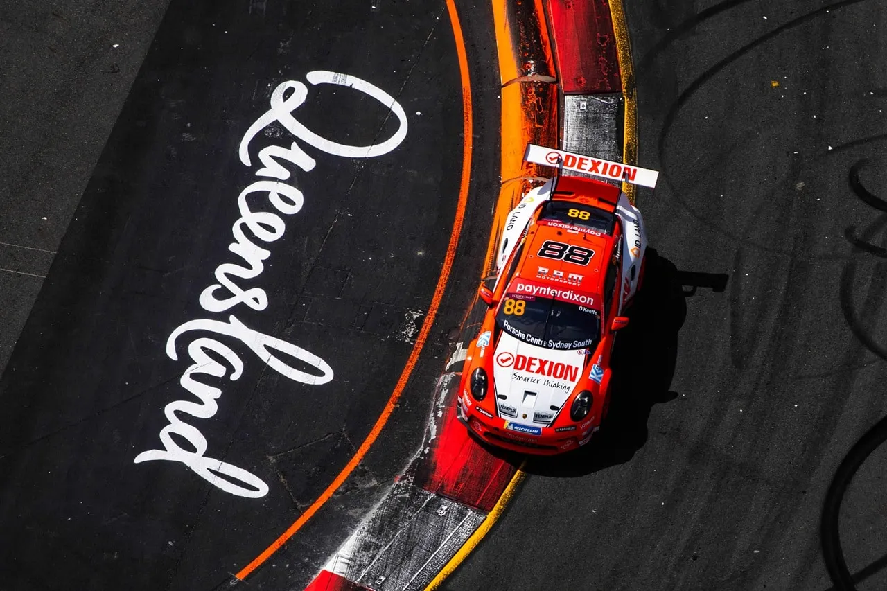 Overhead view of the Dexion Porsche #88 on track beside Queensland painted on the road