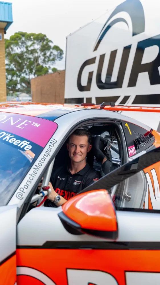 Dylan O’Keeffe seated in the Porsche outside the GWR workshop