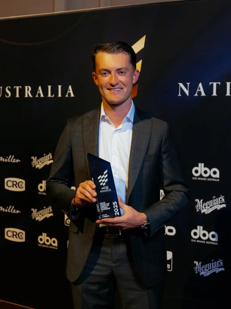 Dylan O’Keeffe holding an award at the Motorsport Australia awards night