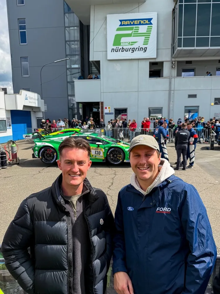 Two men in jackets in the Nürburgring 24 Hour paddock