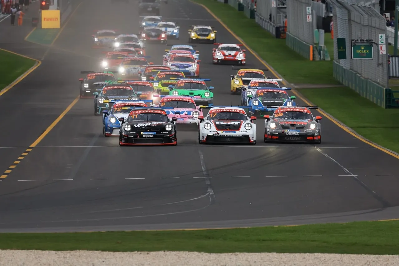 The grid of Porsche Carrera Cup cars leaving the start line on the Albert Park straight